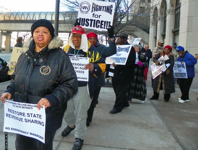 Protester Sandra Hines demands restoration of state revenue sharing to Detroit during protest at Cadillac Place State Bldg. March 4, 2013.