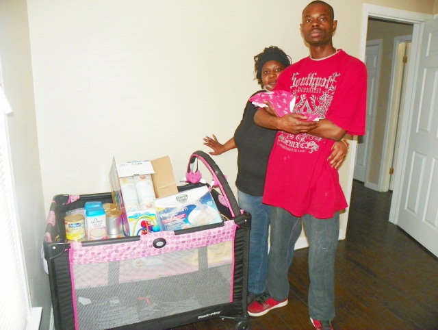 Tamikio and dad with Atjamino baby supplies