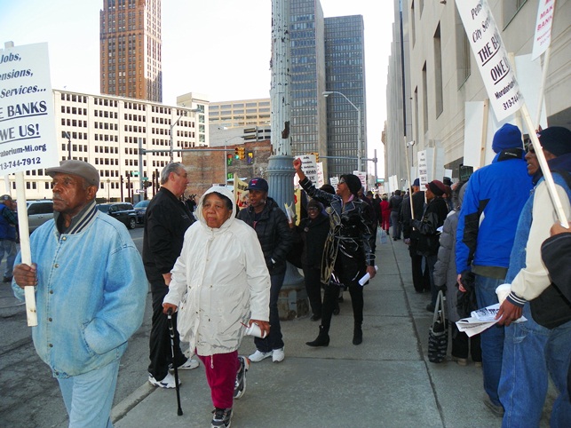 Marchers pack sidewalks outside federal courthouse in Detroit April 1, 2014.