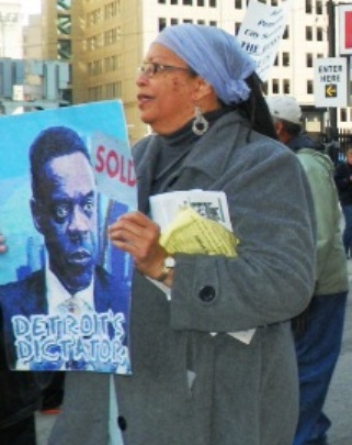 Protester denounces dictator Kevyn Orr during April 1, 2014 march.