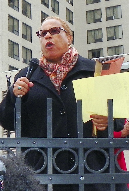 Activist attorney Alice Jennings exhorts marchers to shut Detroit down May 1.