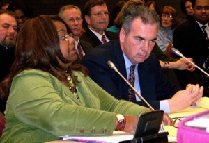 Kym Worthy testifies at state legislature hearing with Moran at her side.