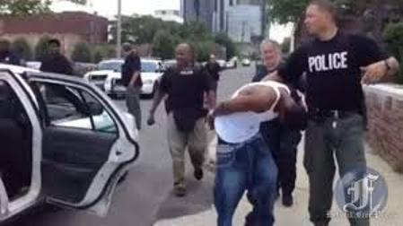 Youth arrested by Detroit police; they also arrested Freep photographer Mandi Wright.