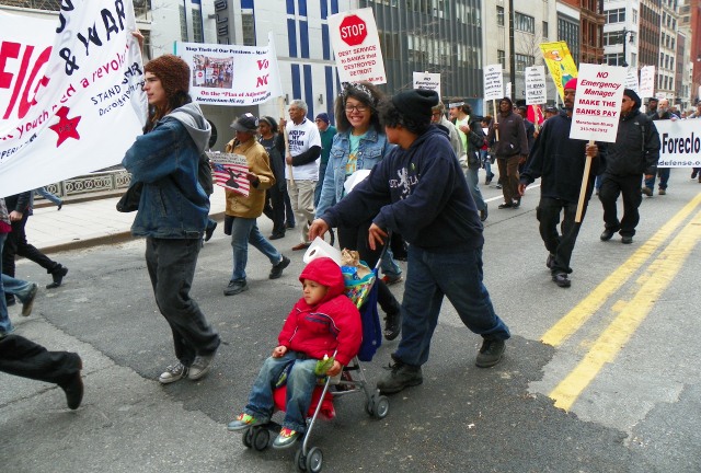 Babies and youth take the march back down Woodward.