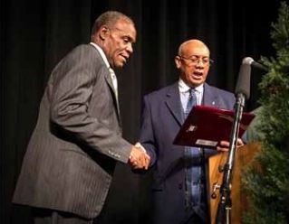 Rev. Pinkney gives award to actor Danny Glover at Justice Dinner in Benton Harbor last year.