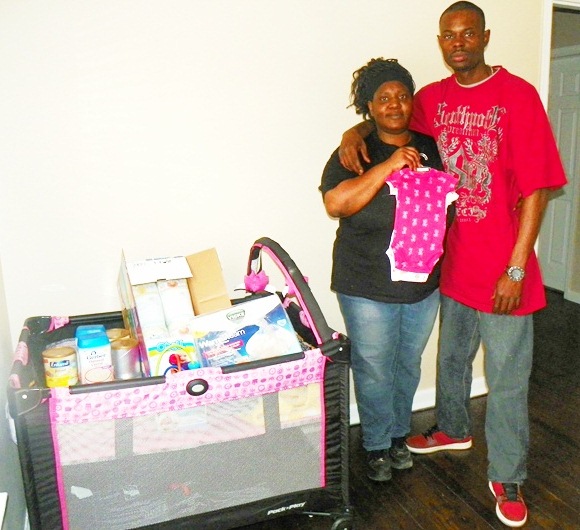 Tamikia McGruder and Arthur Simmons show crib and supplies ready for their baby Atjamino.