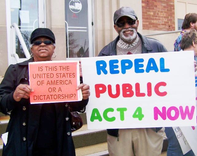 Detroiter Wanda Hill and Benton Harbor resident George Moon at first rally against PA 4 in 2011, on Benton Harbor city hall steps. PA 4 was indeed repealed, only to be replaced by PA 436.