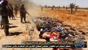War crime: ISIS operatives execute police and soldiers in open field.