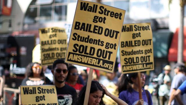 Protesters in LA called for student debt cancellation, explaining that Wall Street banks got trillions from taxpayers and should provide free education in turn.