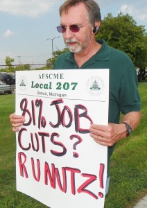 Mike Mulholland at informational picket at Huber facility in 2012. Not only does the Detroit bankruptcy plan affect retirees, it will end up seizing control of the Water Department. Hundreds have already been laid off and more are expected. The more city employees laid off, the greater the damage to city pension funds.