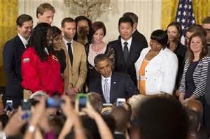 Pres. Barack Obama signs student debt re-financing order.