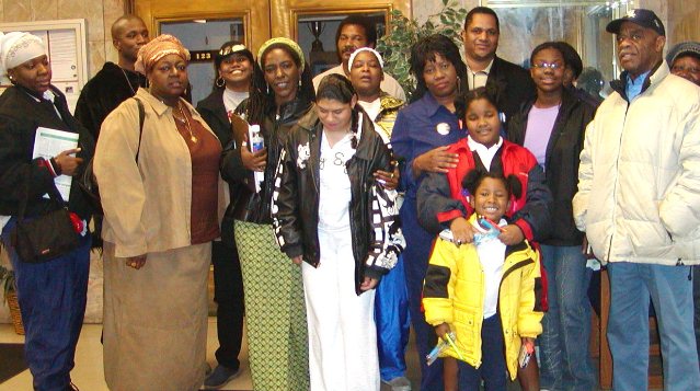 Members of the Original Detroit Coalition Against Police Brutality after they testified at a Police Commission hearing several years ago. Mailauni is at center in white dress, with her mother Lennette behind her; to her left is Arnetta Grable, and behind her is Cornell Squires. Grable spearheaded a 10-year campaign for justice for her son Lamar Grable, killed by Detroit police officer Eugene Brown in 1996.