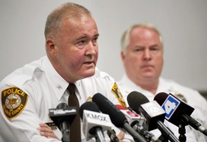 St. Louis County Police Chief Jon Belmar (left) talks about the fatal shooting of unarmed teen Michael Broown as Ferguson Police Chief Thomas Jackson listens during a news conference Sunday in Missouri.