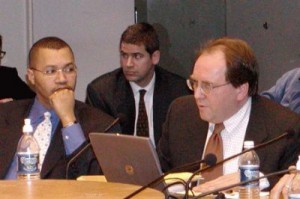 Former Detroit CFO Sean Werdlow (l) at council hearing on $1.5 B COPs loan Jan. 31, 2005. Speaking in support of deal in Joe O'Keefe of Fitch Ratings. Bill Doherty of SBS is in center, Photo: Diane Bukowski
