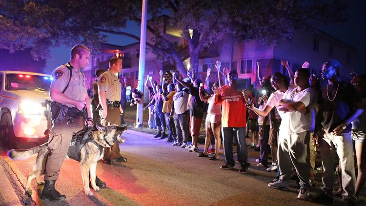 Michael Brown crowd confronts police with dogs