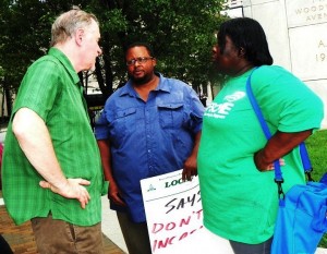 Riehl consults with local union members including Local 207 VP Lakita Thomas during protest Aug. 2, 2012.