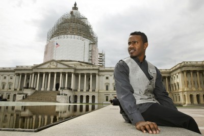 In this photo take on Friday, May 1, 2015, Abraham Tesfahun, 21, who works in food service at the Senate and makes $10.70 an hour, poses for a portrait at the Capitol in Washington. Income inequality is more than a political sound bite to workers in the Capitol. It's their life. Many of the Capitol's food servers, who make the meals, bus the tables and run the cash registers in the restaurants and carryouts that serve lawmakers, earn less than $11 an hour. Some make nothing at all when Congress is in recess. (AP Photo/Jacquelyn Martin)