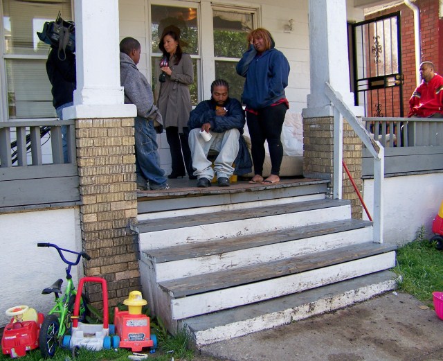 Charles Jones is interviewed by Channel 2 reporter Amy Lange the morning of his daughter's death on family's porch. Toys shown are also in evidence tech photos of the scene directly after the raid.