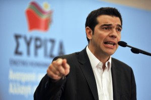 Greek leader Alexis Tsiparas in front of his party's flag, is trying to sell new austerity measures to his parliament.