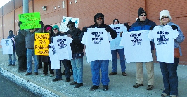 Detroit retirees accuse Rhodes, Orr, Rosen of grand theft, robbing workers, during protest.
