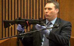 Weapons expert Brent Sojea with gun that killed Aiyana.