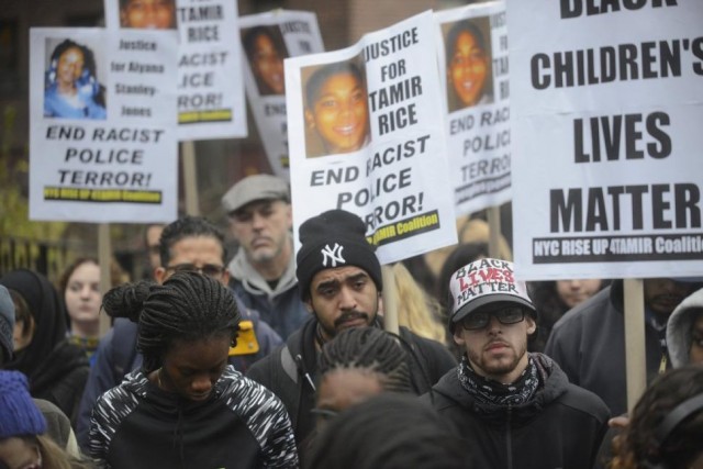 Protesters remember Tamir Rice, Aiyana Jones, children killed by cops in Cleveland and Detroit, during rally in Brooklyn, NYC Nov. 22, 2015.