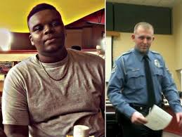 Mike Brown, 18, of Ferguson, MO, and his executioner KKKop Darren Wilson.
