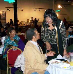 Gwen Mingo, formerly chair of Brush Park CDC, talks with Jimmy Cole at Call 'Em 'Out dinner Feb. 25, 2012.