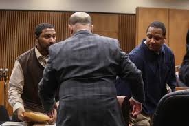 Charles Jones (l) and Chauncey Owens (r) during trial; Jones' attorney Leon Weiss with back to camera.