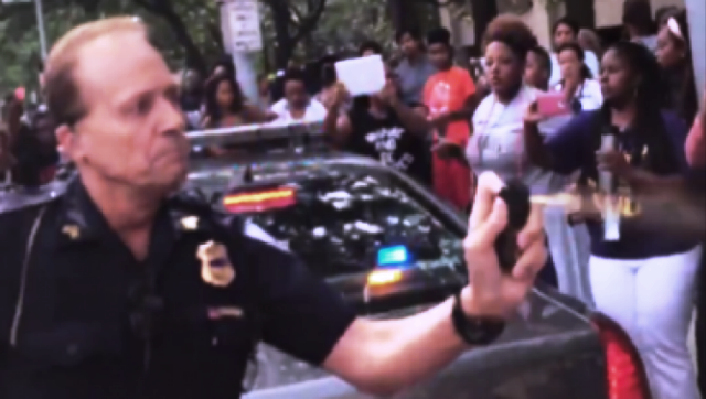 Cleveland cop pepper sprays attendees at Black Lives Matter convention.