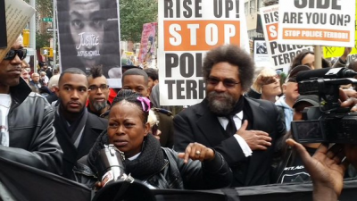 Cornel West marches with families of police terror victims.