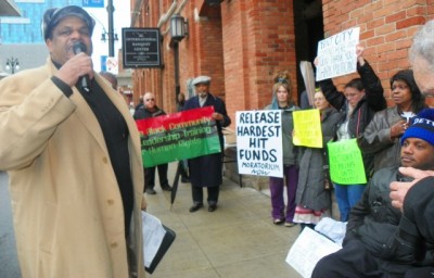 Cornell Squires speaks at protest outside Wojtowicz office March 31, 2015.