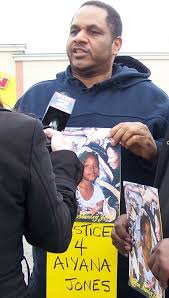 Squires at protest on anniversary of Detroit police killing of Aiyana Jones, 7, in 2010.