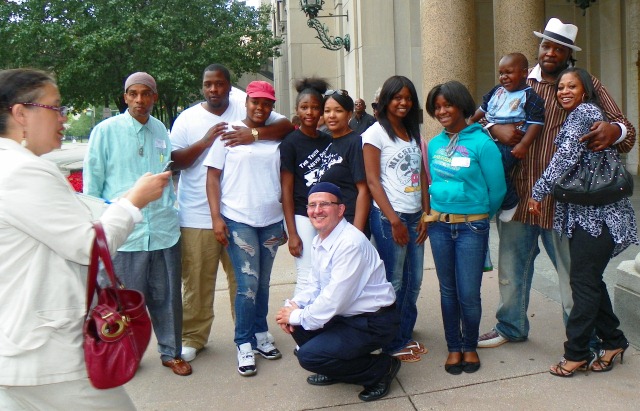 Davontae Sanford family and supporters after appeals court hearing August 6 Mother Taminko Sanford-Tilmon and stepfather Jermaine Tilmon at right. Detroit News reporter takes their photo at left.