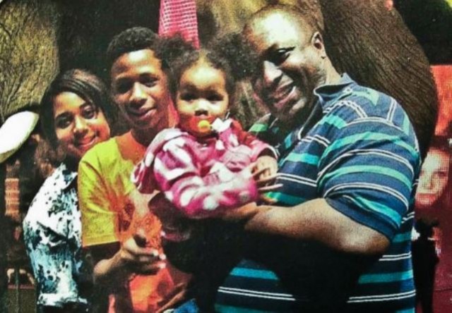 Eric Garner with three of six children