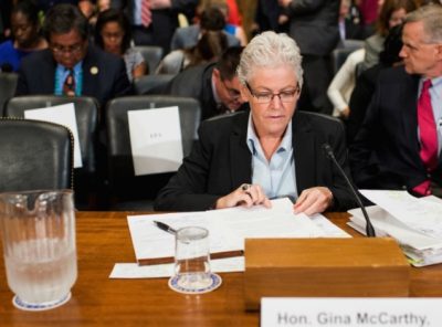 EPA head Gina McCarthy testifying at Congress Sept. 15, 2015 about Flint water crisis. That is obviously NOT a jug of Flint water at her side.