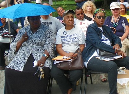 Long-time Detroit education activist Helen Moore (center), attended the New Orleans conference and reported back from it at a People's Assembly in Detroit August 29, 2015. She is flanked by (l) former City Councilwoman JoAnn Watson and (r) Cecily McClellan, VP of the Detroit Active and Retired Employees Association (DAREA).