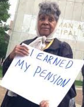 Detroit retiree protests at Coleman A. Young Municipal Center.