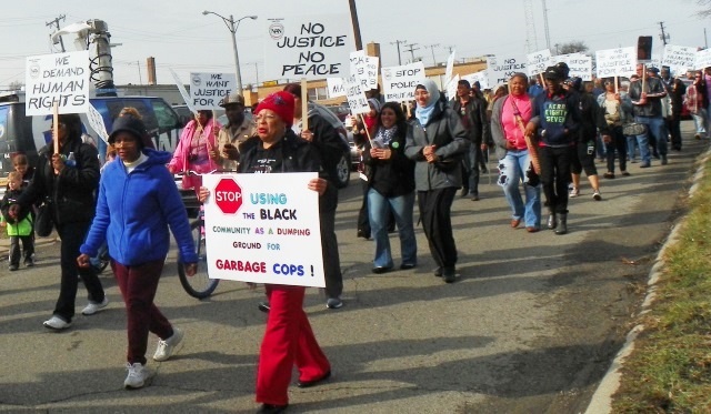 Hundreds march in Inkster April 2 to demand justice for Floyd Dent, an end to "garbage police" like William Melendez, who it turns out, remains as a cop in Highland Park.