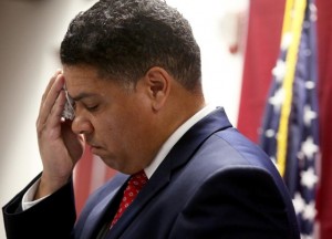 Dane County DA Ismael Ozanne wipes sweat from his face as he announces decision not to charge white cop in Tony Robinson, Jr. death March 6.