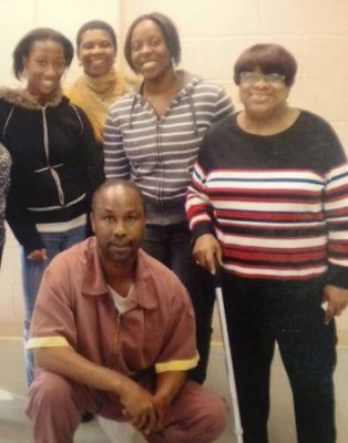 Philadelphia juvenile lifer Tyrone Jones, with family, was re-sentenced to parolable term after city's DA banned all JLWOP sentences.