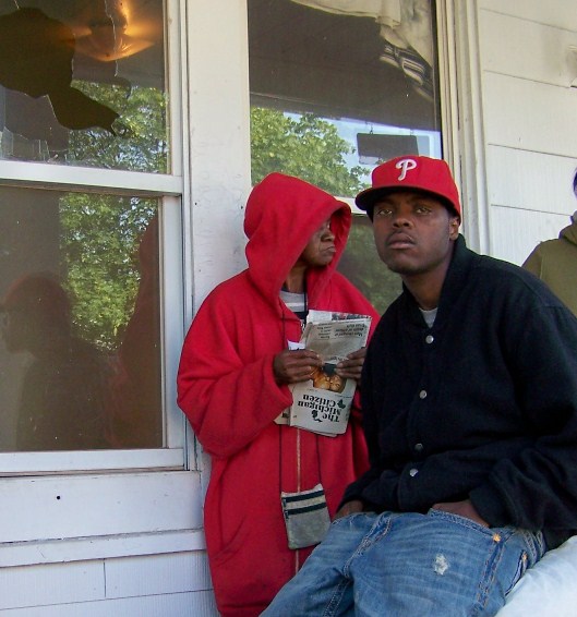 oAnn Robinson and grandson Mark Robinson on porch morning of Aiyana killing May 16 2010. Ms. Robinson passed away within the year. Photo by Diane Bukowski