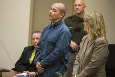 Juan Cantu of Grand Rapids stands with SADO attorney Valerie Newman at his right as he listens to judge sentence him to 40-60 years.