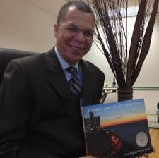 Judge Terrance Keith with his book, "Sunrise on the Detroit River."