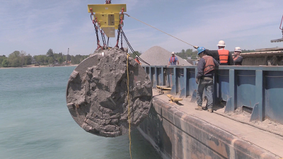 Pipe for Karegnondi Water Authority is hoisted into Lake Huron.