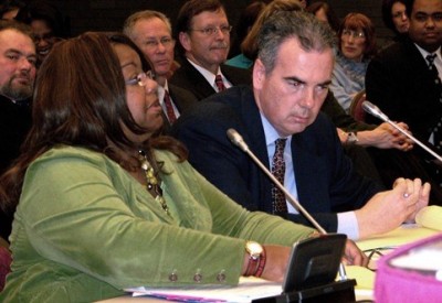 Wayne County Prosecutor Kym Worthy testifies at state legislature with AP Richard Moran at her side.