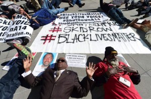Protesters conduct "die-in" on LA street.