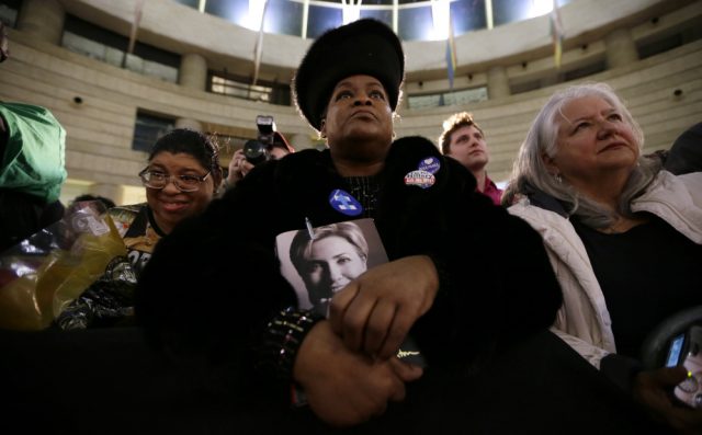 Lennette Williams, with daughter Mailauni at her right, listen as Democratic presidential nominee Hillary Clinton speaks. Photo: Portland Press Herald
