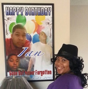Lidjinet Barber with poster remembering her son Ian May, 18, killed by a retired Detroit cop with a past,