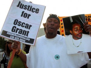 Protester at march supporting Lovelle Mixon, in photo, and protesting police murder of Oscar Grant, in Oakland, CA, 2009.